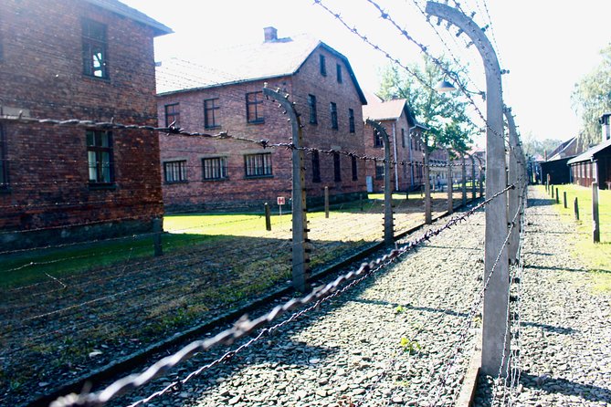 Auschwitz & Wieliczka ONE DAY Guided Tour +Private Transportation - Entering Auschwitz-Birkenau: Security Checks, Headphones, and Group Pacing
