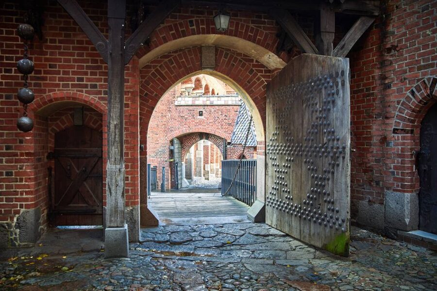 From Gdansk: Half-Day Malbork Castle Tour with Audioguide - Entering the Palace of the Grand Master and St. Mary’s Church