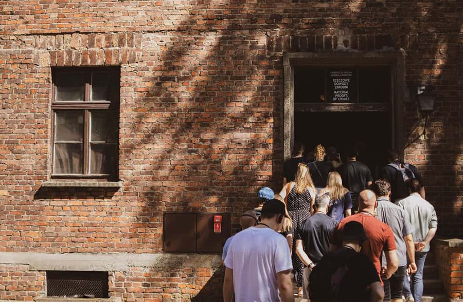 From Krakow: Auschwitz-Birkenau Live Guided Tour & Pickup - Auschwitz I, Entering Through the Arbeit Macht Frei Gate