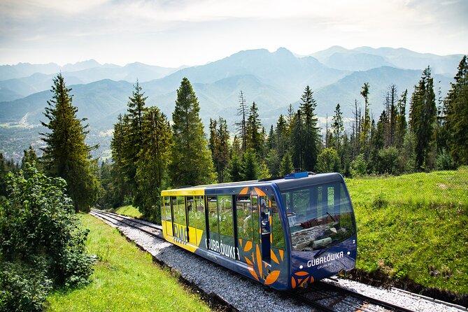 From Krakow: Zakopane Day Trip with Cable Car & Hotel Pickup - Chocholów Village: Wooden Houses and Quick Photo Time