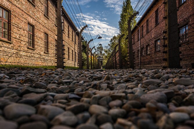 Guided Tour Krakow to Auschwitz-Birkenau with pickup options - Auschwitz I: the main gate and barracks moment