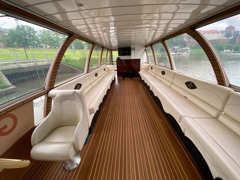 Krakow: Day or Night Vistula River Cruise with Audio Guide - Comfort and boarding: heated lower deck, blankets, and flexible views