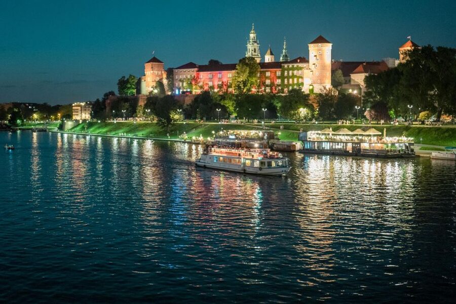 Krakow: Evening Cruise with a Glass of Wine - Boarding vibe: decks, seating, and that first sip