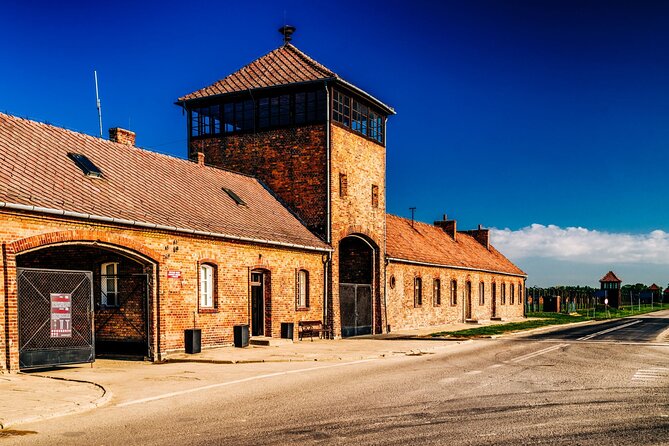 Self-Guided Tour of Auschwitz-Birkenau Museum with Transportation - Entering Auschwitz I through the gate and into the museum core
