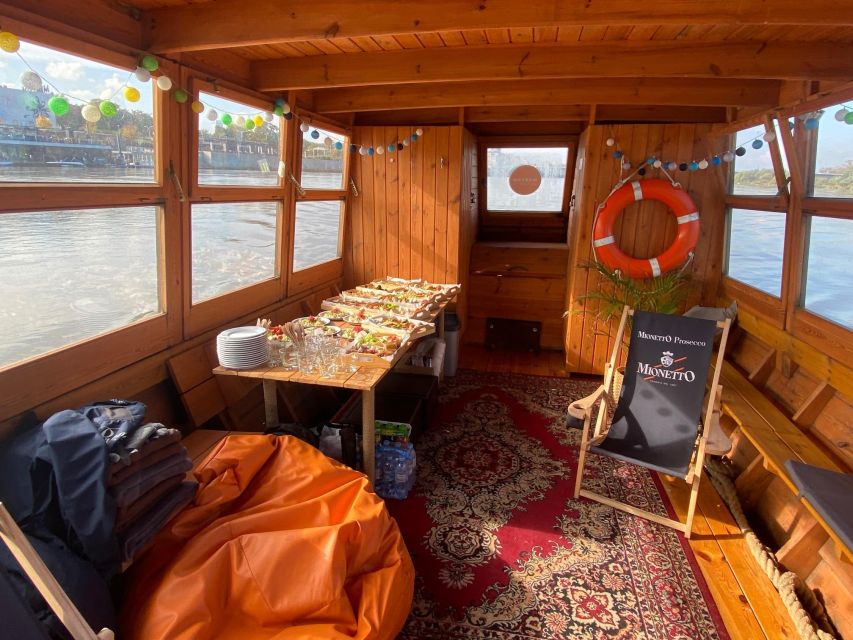Warsaw: Vistula River Sunset Cruise with Welcome Drink - The lush right bank, Port of Prague entrance, and three bridges