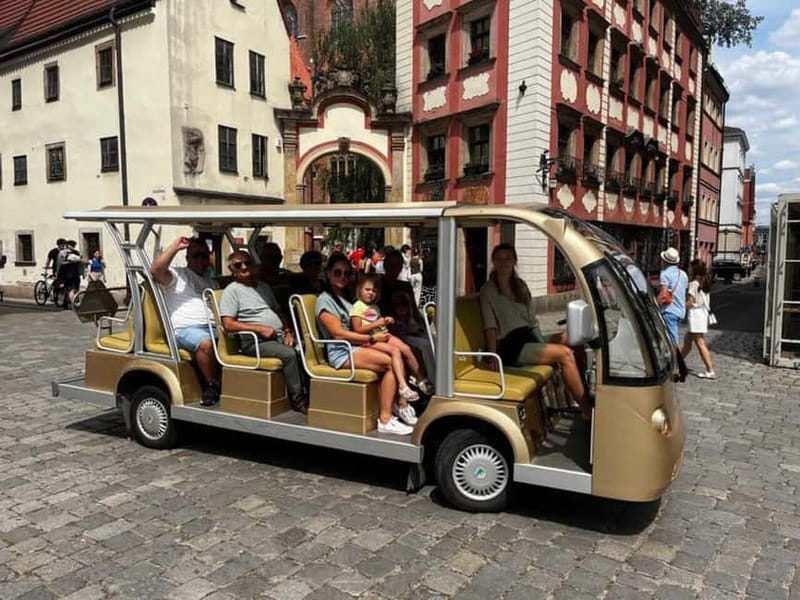 Wroclaw: NO LIMIT BEER City Tour Sightseeing By Golf Cart - Electric Melex golf cart with beer in hand